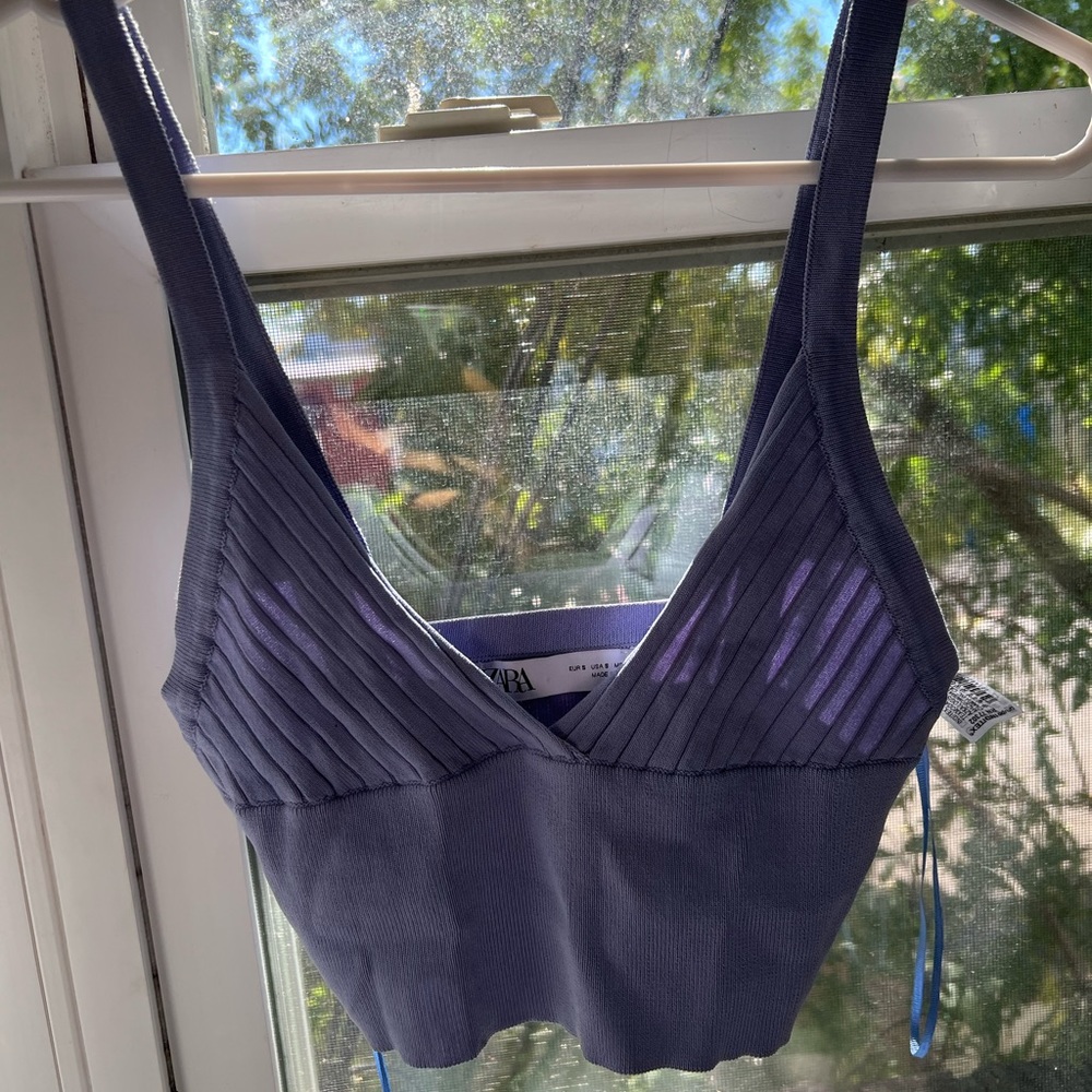 Sky blue top from Zara, soft material.